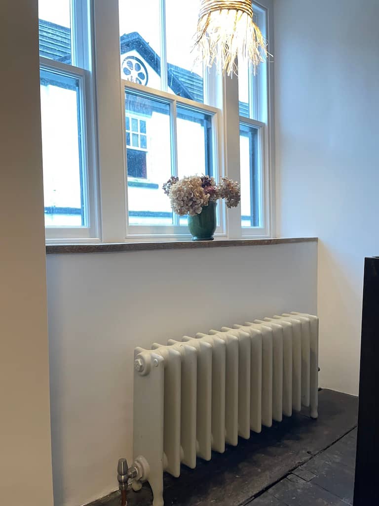 Small hospital style radiator in front of window
