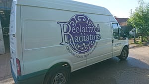Signwritten van with Reclaimed Radiators Logo on it